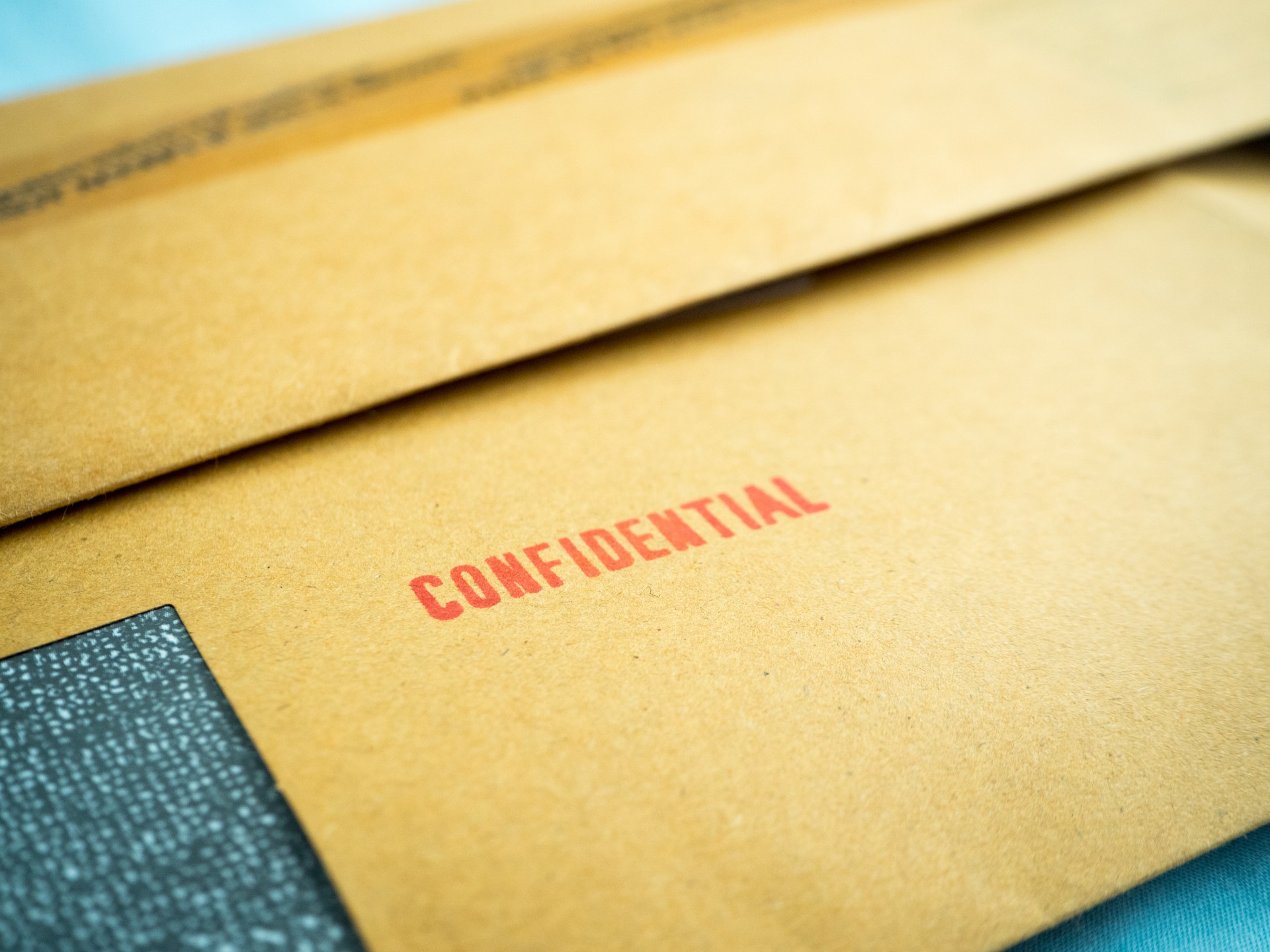 "Confidential" printed on brown vintage envelope, in macro